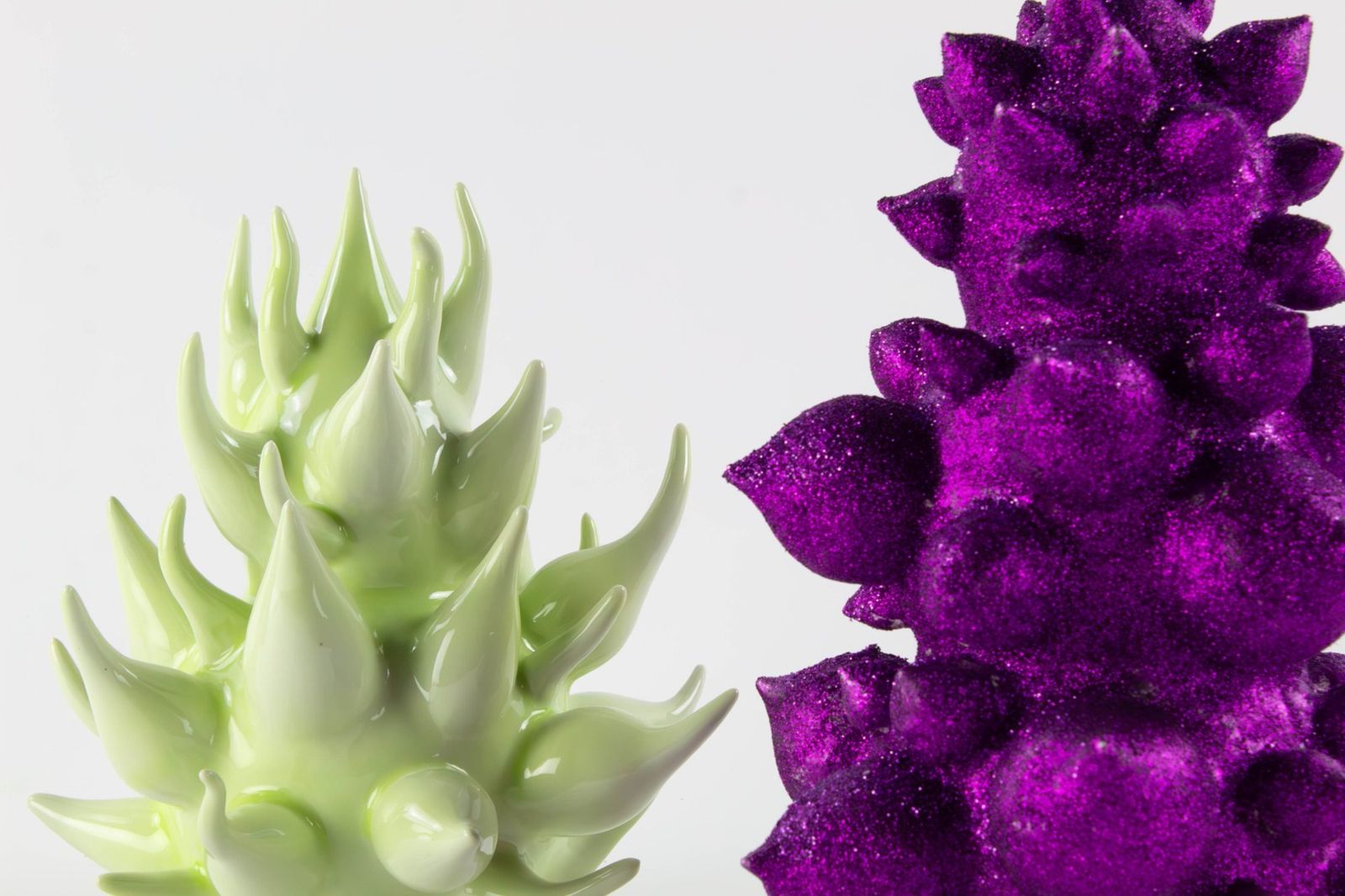 Pale green spiked form beside a purple glitter cluster